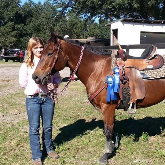 Horseback lessons (and this girl's horse is a blue ribbon winner!